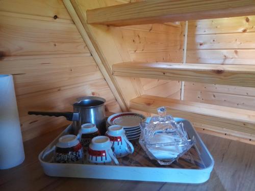 a small kitchen in a wooden stove in a sauna at Pure Nature in Bihać