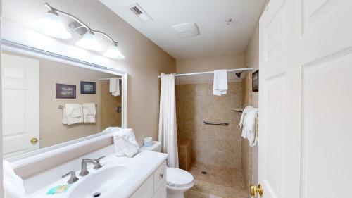 a bathroom with a sink and a toilet and a shower at Pawleys Island Fairway Haven 3BR Villa in Pawleys Island