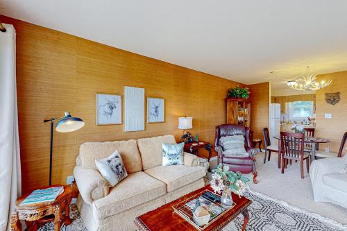 a living room with a couch and a table at Cozy Mountain Nest in Sugar Mountain