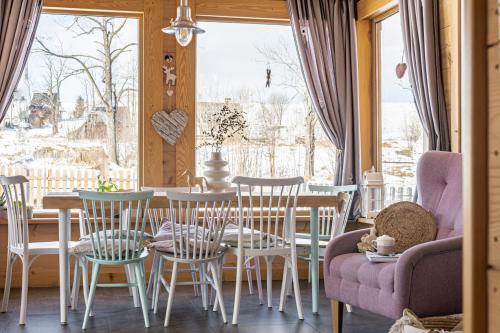 a dining room with a table and chairs at Stylowa Chata in Zakopane