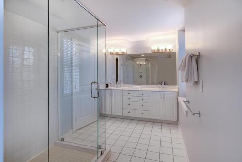 a bathroom with a glass shower and a sink at 8 Village Lane 201 in Asheville