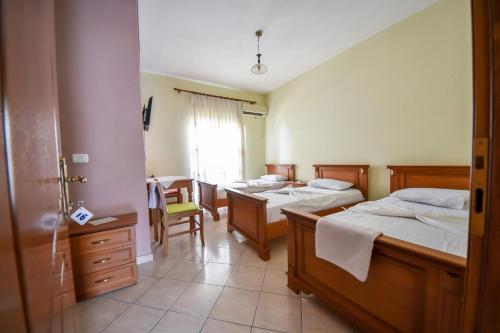 Postel nebo postele na pokoji v ubytování Hotel Geraldo