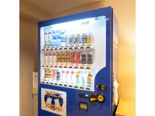 a vending machine filled with bottles of soda at Hotel Terrace The Square Hitachi - Vacation STAY 16979v in Hitachi