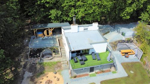 an overhead view of a house with aestead at Dom Granero w Lesie pod Ślężą in Strzegomiany