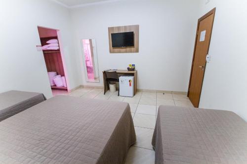 Ένα ή περισσότερα κρεβάτια σε δωμάτιο στο Revitalle Hotel