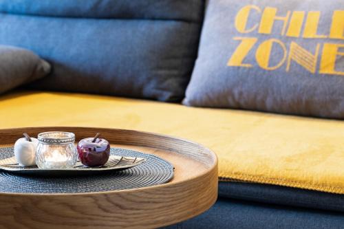 a table with a plate of food on top of a bed at Chill Out Apartments in Landeck