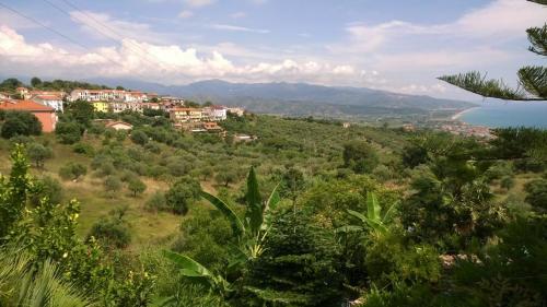 a town on a hill with a body of water at 2 Bedroom, 1 Bath apartment near the sea in Casal Velino