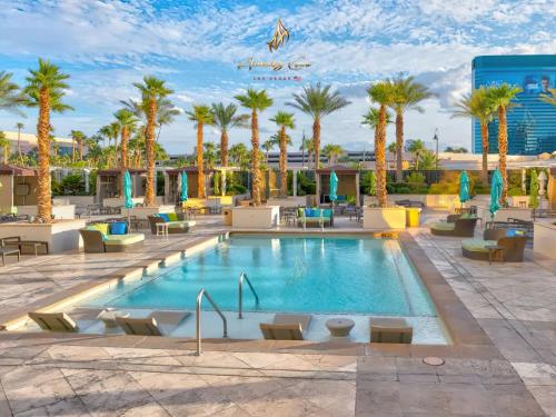 a pool at the hampton inn suites anaheimheim resort at Amalz Two Bedroom Three Bathroom Balcony Suites at Mgm Signature ! in Las Vegas