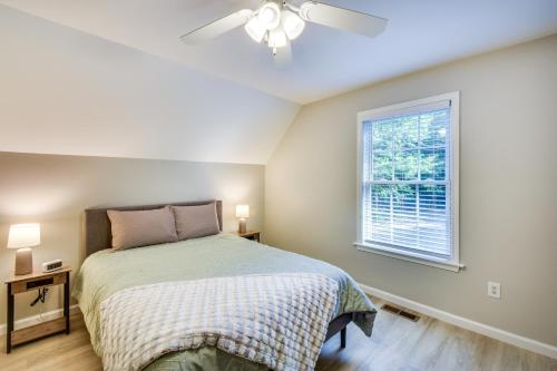a bedroom with a bed and a window at Lake Hartwell Retreat with 2-Tier Dock and Boat Slip! in Seneca