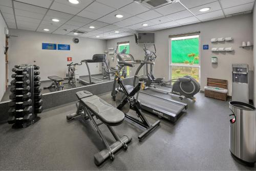 a gym with several treadms and machines in a room at City Express by Marriott Aguascalientes Sur in Aguascalientes