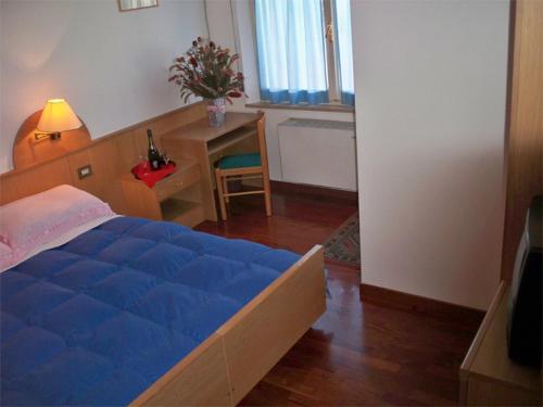 Postel nebo postele na pokoji v ubytování Hotel Bar Dany