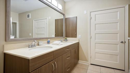 a bathroom with a sink and a mirror at Ponce City Market 2 bdrm in Atlanta