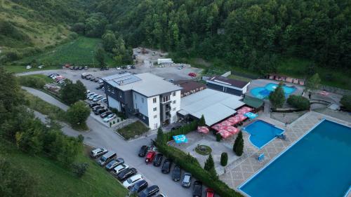 an aerial view of a parking lot with a pool at Motel "KULA" in Cazin