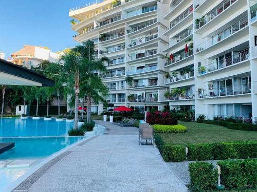 Πισίνα στο ή κοντά στο Gran departamento a 5 min del centro