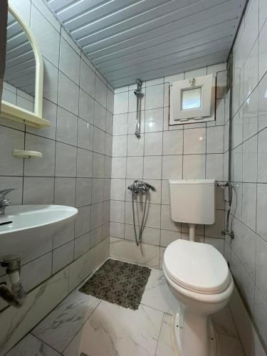 a bathroom with a toilet and a sink at Vacation home ROT Ohrid in Ohrid