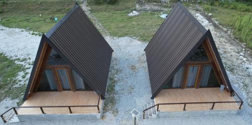 an overhead view of a house with a roof at Bungaja Chalets in Shkodër