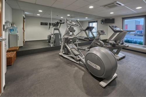 a gym with cardio equipment in a hotel room at City Express by Marriott Monterrey Norte in Monterrey