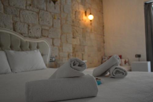 Postel nebo postele na pokoji v ubytování Kybele Suites Alaçatı