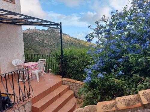 a patio with stairs and a table and chairs at Apartamentos CHRISTINA in Benicàssim