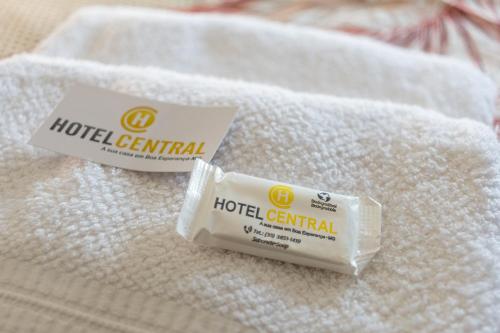 a tube of hotel central toothpaste sitting on top of towels at Hotel Central in Boa Esperança