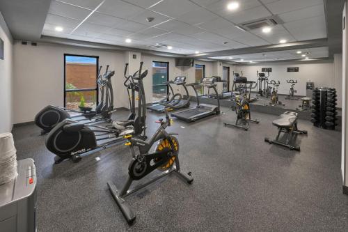 a gym with several tread machines in a room at City Express by Marriott Tijuana Otay in Tijuana