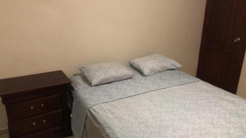 Een bed of bedden in een kamer bij ARCOIRIS SHARE APARTMENT BAVARO PUNTA CANA