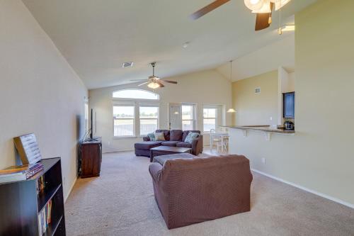 a living room with a couch and a table at Family-Friendly Killeen Home with Covered Patio! in Killeen