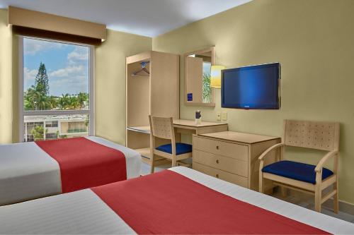 Postel nebo postele na pokoji v ubytování City Express by Marriott Campeche