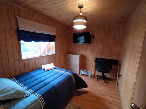 Una cama o camas en una habitación de Cabaña Parque Austral