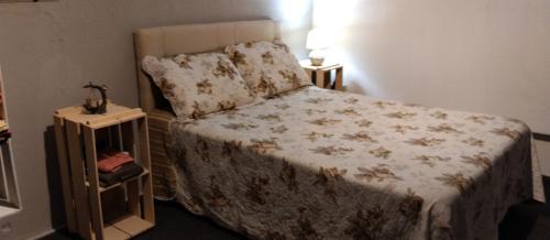 a bedroom with a bed and two night stands at La Juana in Carmelo