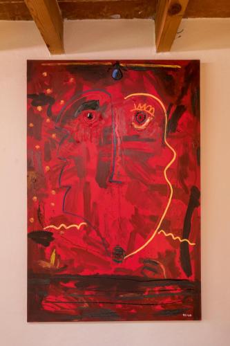 a painting of a man on a wall at Meztli: Casa Boutique & Spa in Mexico City