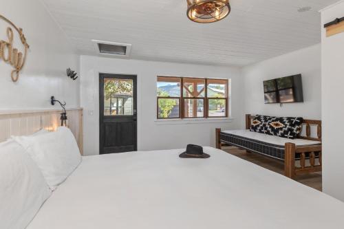 Ένα ή περισσότερα κρεβάτια σε δωμάτιο στο Hotel Palomino