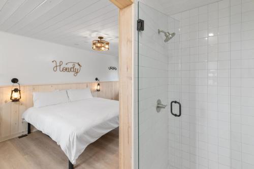 Ένα ή περισσότερα κρεβάτια σε δωμάτιο στο Hotel Palomino