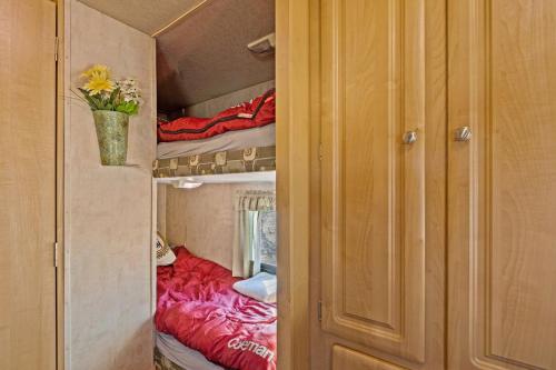 a small room with a bed and bunk beds at JT Village Campground - Star Stream in Joshua Tree