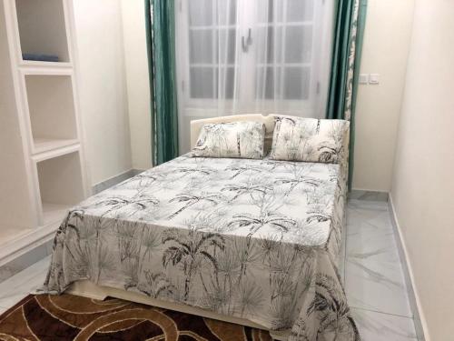 Ένα ή περισσότερα κρεβάτια σε δωμάτιο στο villa piscine timbamba