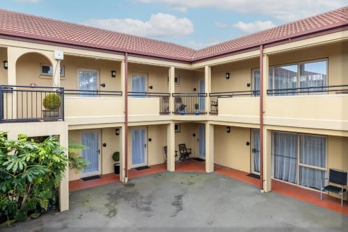 a view of the outside of a building with balconies at Lorenzo Motor Lodge in Christchurch