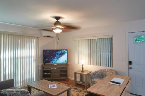 a living room with a couch and a tv at South Maui 1 BR Guest Suite - Kamaole Beach Area in Wailea