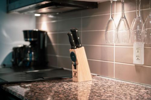 a knife block sitting on top of a kitchen counter at Great View High Rise in Central Toronto in Toronto