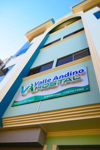 a sign on the side of a building at Hostal Valle Andino in El Tambo