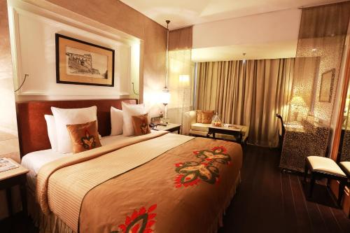 a hotel room with a large bed in it at The Ashok, New Delhi in New Delhi