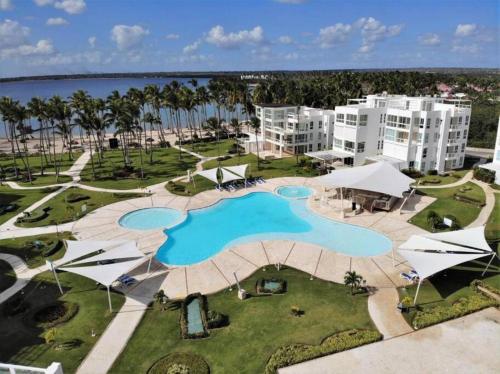 an aerial view of a pool at a resort at Apartamento en Playa Nueva Romana in La Romana