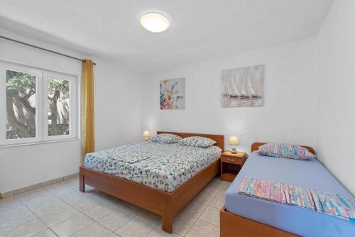 Postel nebo postele na pokoji v ubytování Apartments Uga2 - 70m from the beach