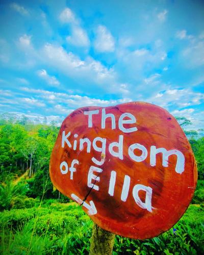a red sign that reads the kingdom of fire at The kingdom of ella in Ella