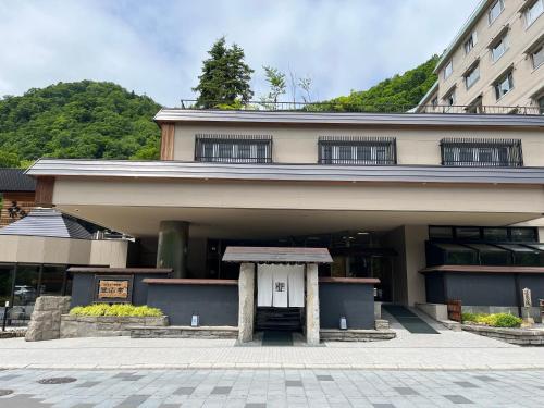 a building with a door in front of it at Jozankei Daiichi Hotel Suizantei in Jozankei