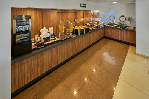 a food counter in a restaurant with a buffet at City Express by Marriott Nogales in Nogales