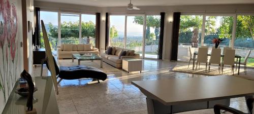 a living room with a couch and a table at Mythos luxury apartments in Corfu Town