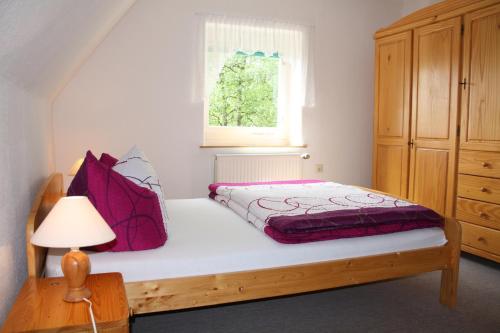 מיטה או מיטות בחדר ב-Pension Haus Pentacon