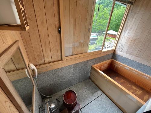 a small kitchen with a sink and a window at Jozankei Daiichi Hotel Suizantei in Jozankei