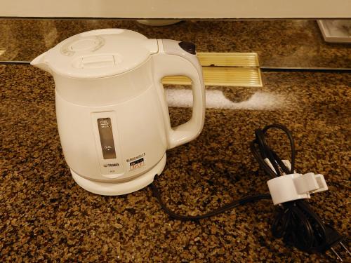 a white blender sitting on a counter with a cord at Restay Puchi Nagasaki Club (Adult Only) in Nagasaki