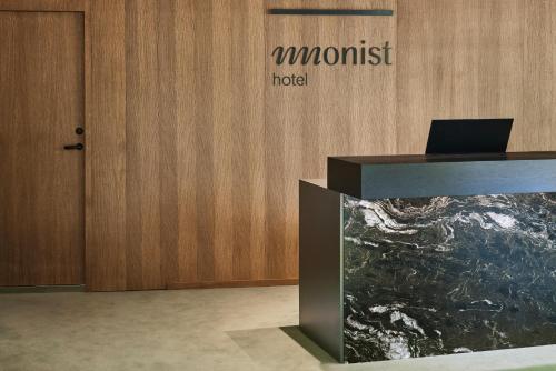a lobby with a desk with a laptop on it at Monist boutique by SPA VILNIUS in Palanga